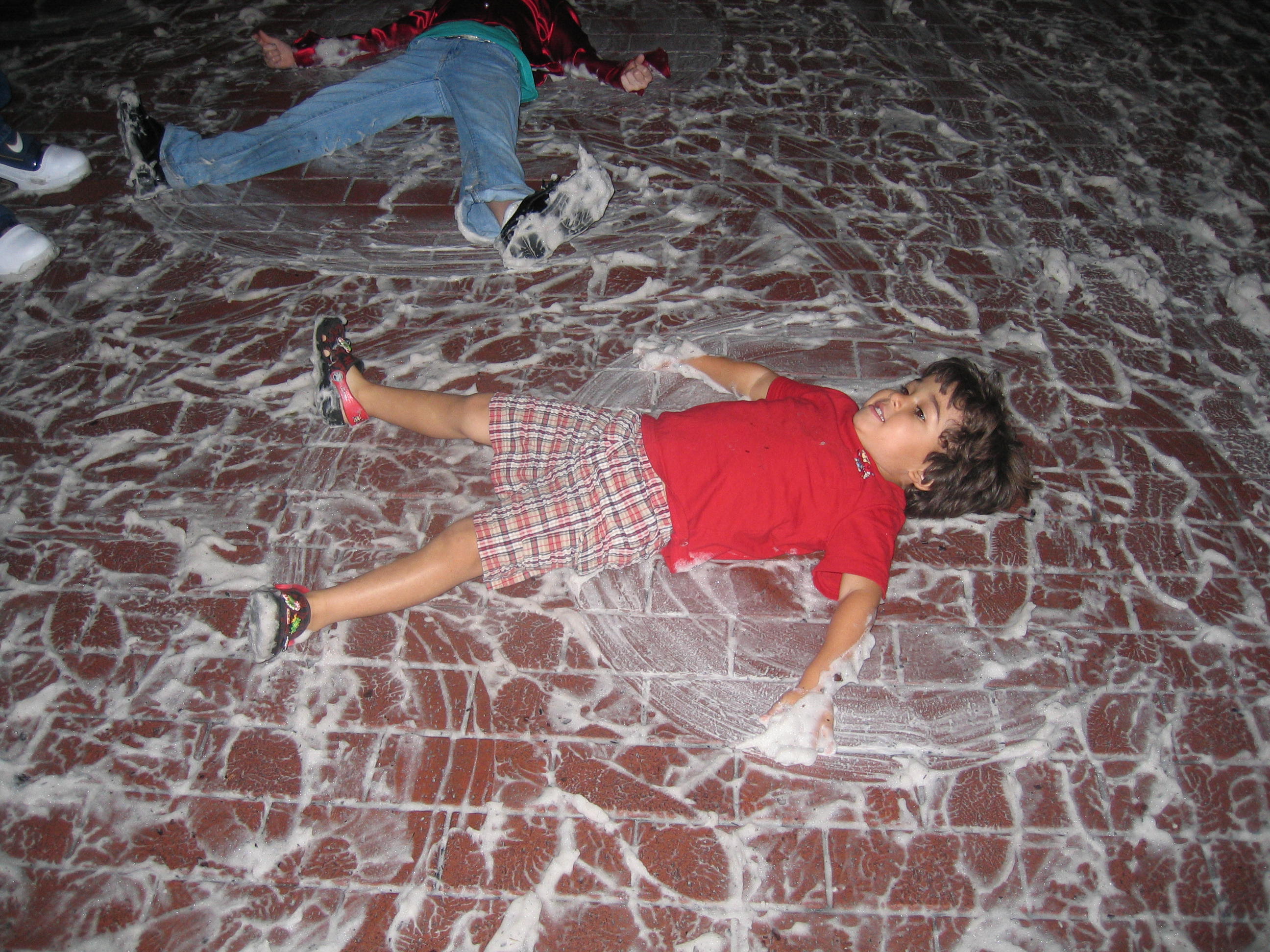 Poor little Florida-boy Nate trying in vain to make a snow angel out of the "soap snow" that falls in Celebration every year.