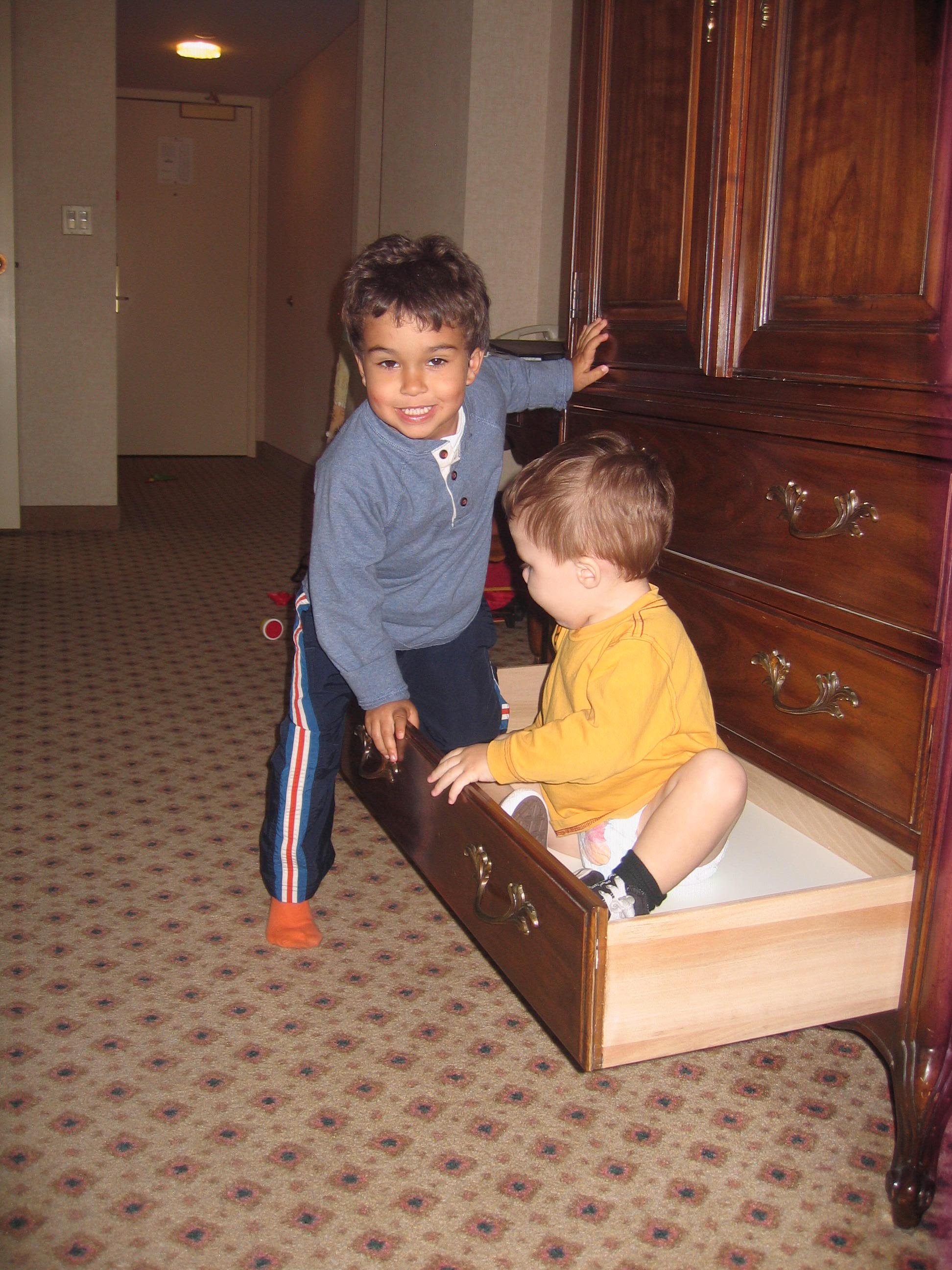 Nate & Zeke try out their bed...I'm kidding! Only Zeke could fit in that drawer.