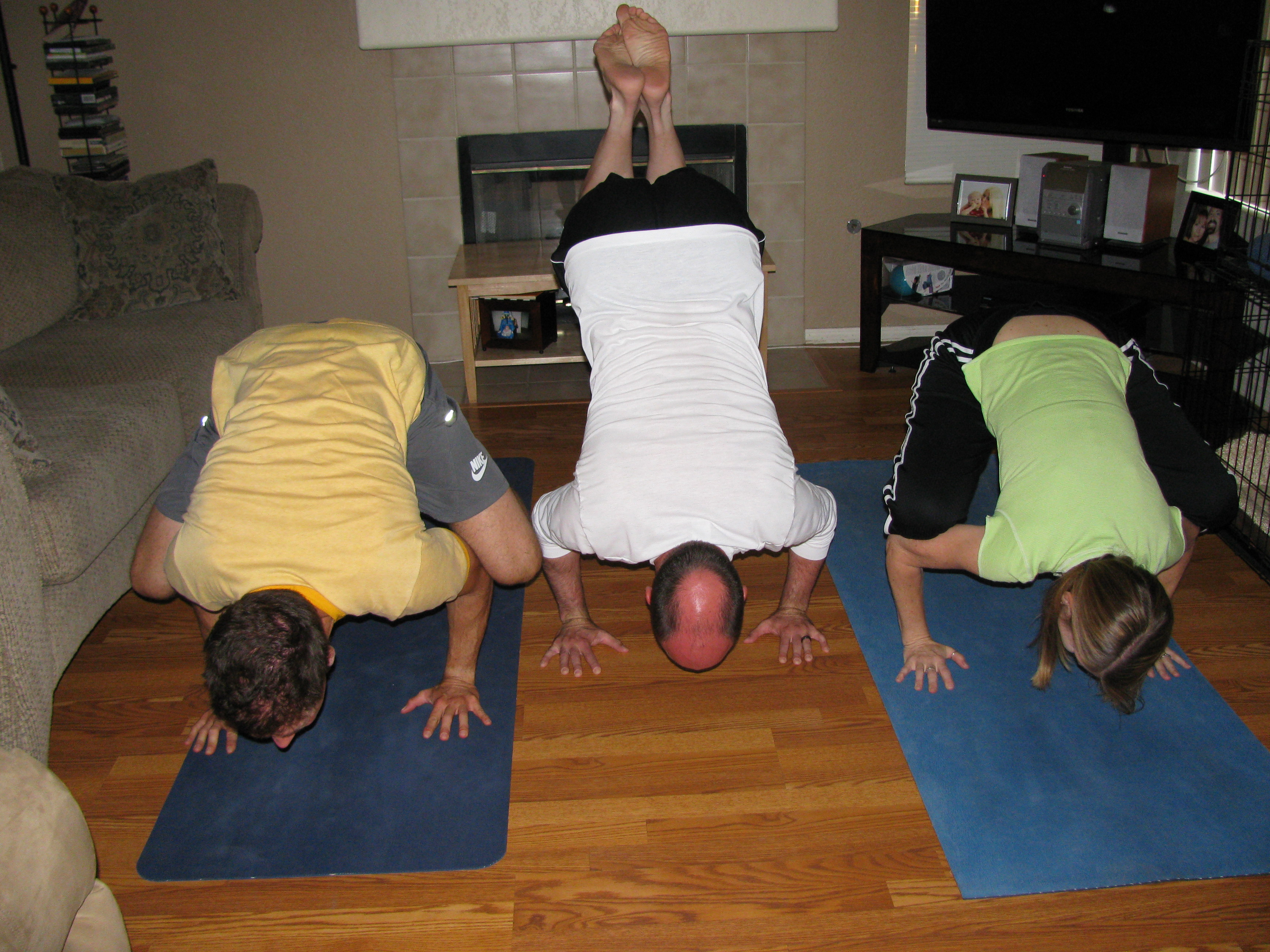 This is "Crow Pose". You can't really tell, but our heads and feet are off the ground. We're just balancing on our hands. For some reason, I can do this pose with relative ease. Needless to say, all present (including me) were impressed.